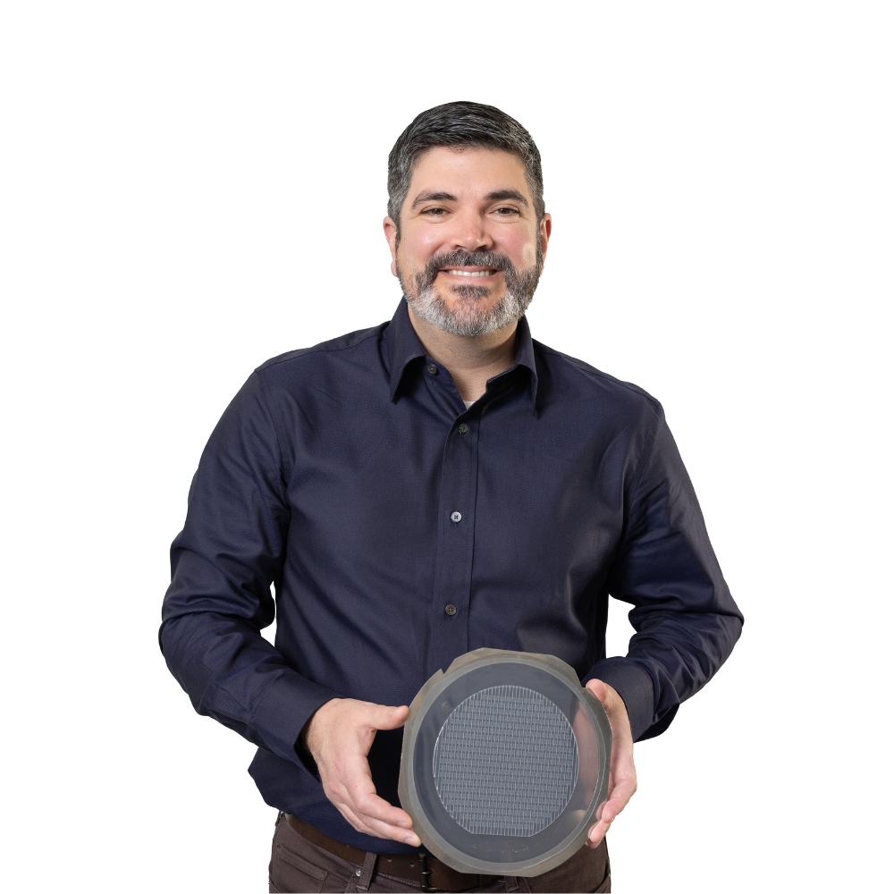 Man holding wafer and smiling